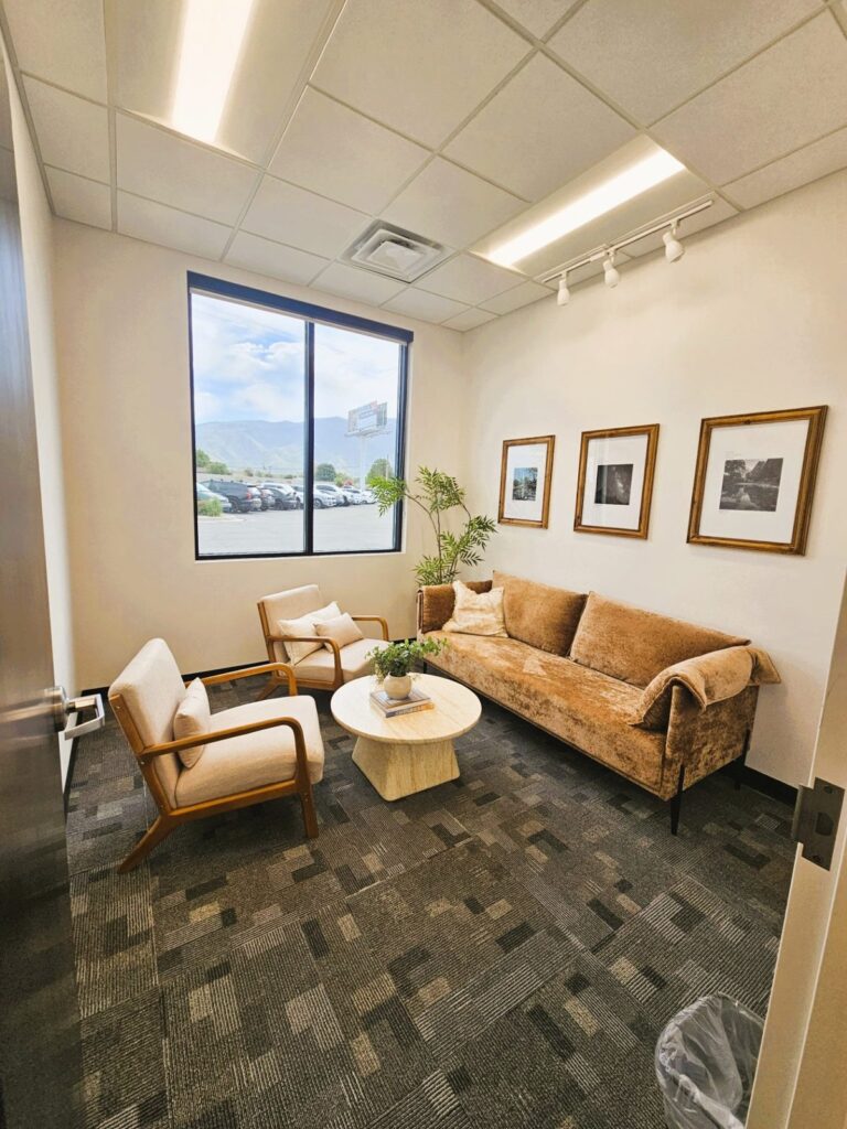 Patient consult room with lounge seating at Crossover Health in Layton, Utah, a medical office tenant improvement by PJF Corporation