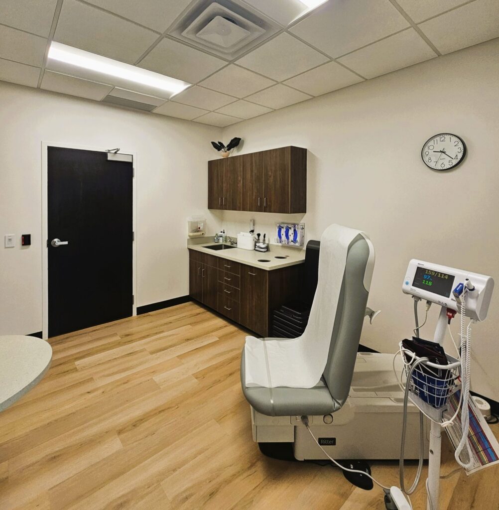 Exam room with custom casework and sink at Crossover Health in Layton, Utah, healthcare construction by PJF Corporation