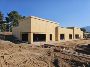 New multi-tenant office building under construction in Layton, Utah, built on a sloped site by PJF Corp