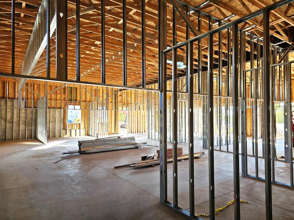 Office building construction in Layton, Utah, with large window openings framing mountain views