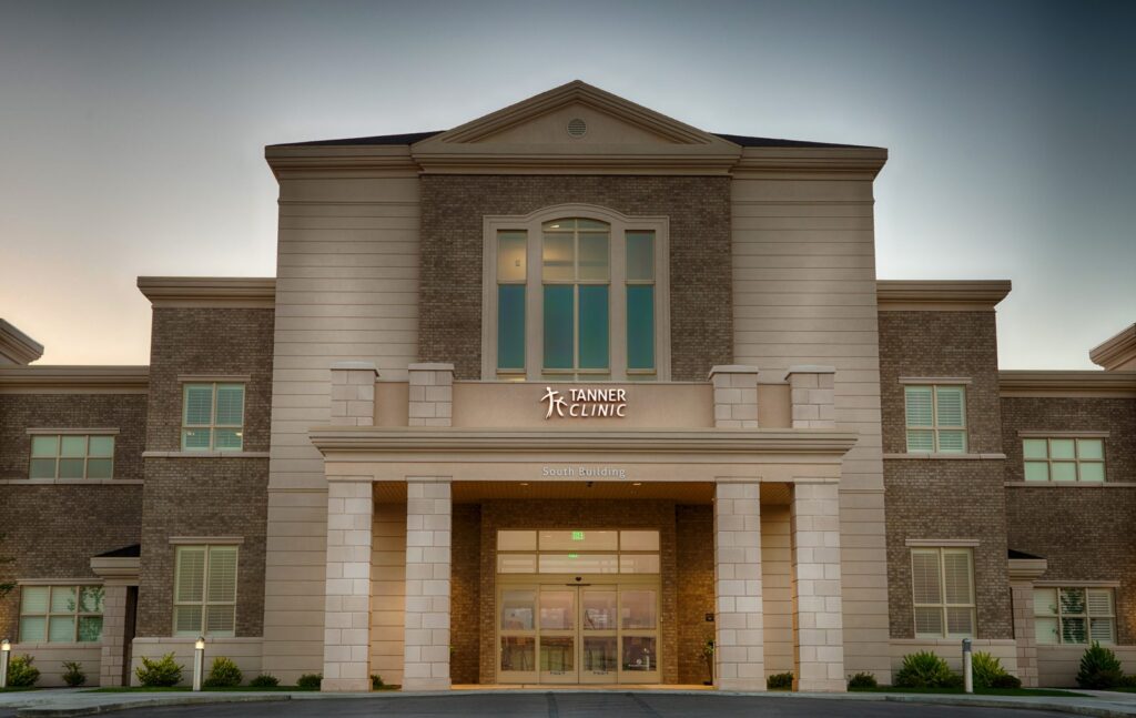 Main entrance with stone columns and covered drop-off at the Tanner Clinic Women's Center in Layton, Utah, built by PJF Corporation
