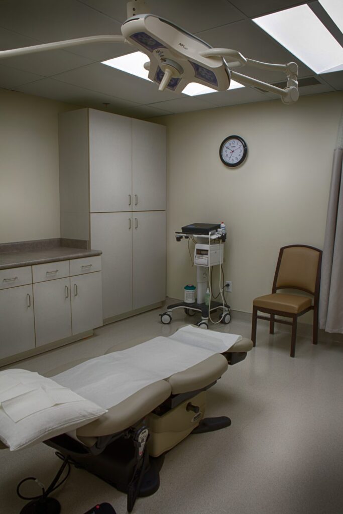 Procedure room with surgical light and casework at the Tanner Clinic Women's Center in Layton, Utah, built by PJF Corporation